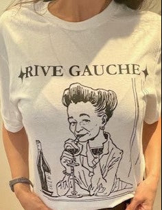 Person wearing a white t-shirt with a graphic design and text 'RIVE GAUCHE'.